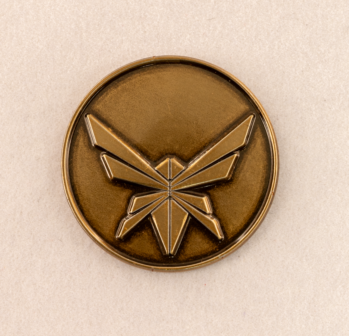 Golf ball marker set displayed on grass surface